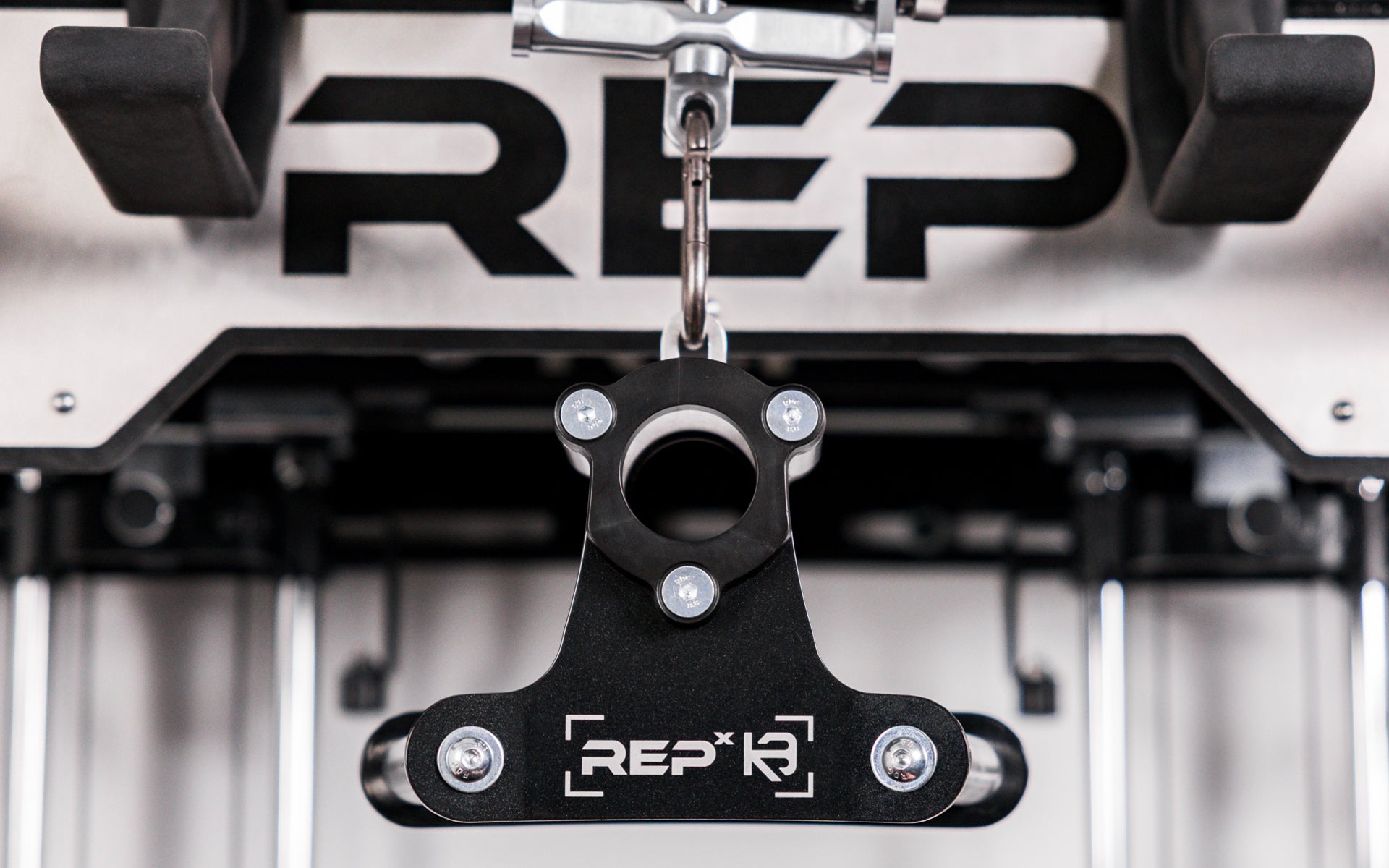 REP® x Kleva Built® Angled Atlas™ Close-Grip Cable and Landmine Attachment on the lat pulldown cable on an Ares™ 2.0