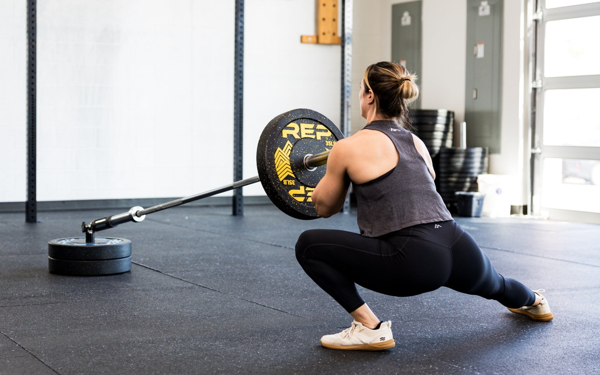 An athlete performing lateral lunges with the Free Standing REP® x Kleva Built® Adroit Landmine
