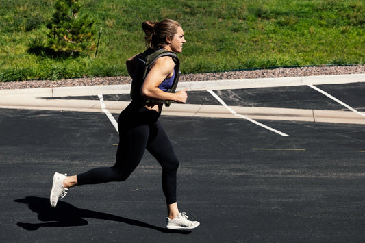An athlete trains in Zone 2 with the Strata™ weight vest on.
