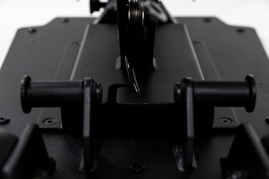 Close-up shot of the band pegs and cable housing on the Leg Extension & Leg Curl Bench Attachment